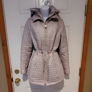 NWOT. Small light gray quilted jacket. Never worn